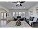 Open-concept living space boasting hardwood floors, a ceiling fan and lots of natural light and access to breakfast nook at 4495 Hedgewood Dr, Cumming, GA 30041