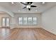 Open living space with hardwood floors, recessed lighting, and access to the outdoors at 4495 Hedgewood Dr, Cumming, GA 30041