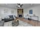 Bright living room featuring modern decor, hardwood floors, stone fireplace, ceiling fan and recessed lighting at 4495 Hedgewood Dr, Cumming, GA 30041