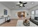Open-concept living area offering hardwood floors, open access to the kitchen and breakfast nook, and modern decor at 4495 Hedgewood Dr, Cumming, GA 30041