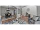 Open concept living and dining areas with hardwood floors and decorative columns at 4495 Hedgewood Dr, Cumming, GA 30041