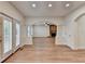 Bright living space with hardwood floors, a charming brick fireplace, and multiple windows at 4495 Hedgewood Dr, Cumming, GA 30041