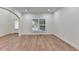 Bright living area with hardwood floors and a view of the front door at 4495 Hedgewood Dr, Cumming, GA 30041