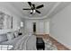 Bedroom featuring a ceiling fan, hardwood flooring, and natural light at 4495 Hedgewood Dr, Cumming, GA 30041