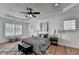 Bedroom featuring a ceiling fan, hardwood flooring, and natural light at 4495 Hedgewood Dr, Cumming, GA 30041