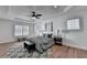 Bedroom featuring a ceiling fan, hardwood flooring, and natural light at 4495 Hedgewood Dr, Cumming, GA 30041