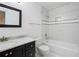 Bathroom offering a marble countertop vanity with shower and bath combination is beautifully tiled at 1105 Pine Heights Ne Dr, Atlanta, GA 30324