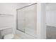 Clean bathroom featuring a shower tub with glass doors at 1105 Pine Heights Ne Dr, Atlanta, GA 30324