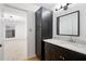 Bathroom with marble countertops, hardwood floors, and plenty of lighting; attached to an adjoined bedroom at 1105 Pine Heights Ne Dr, Atlanta, GA 30324