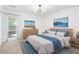 Stylized bedroom with large windows, a dresser, night stands, and neutral decor at 1105 Pine Heights Ne Dr, Atlanta, GA 30324