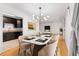 Stylish dining room adjacent to kitchen with modern lighting, beautiful table, and inviting atmosphere at 1105 Pine Heights Ne Dr, Atlanta, GA 30324