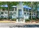 Attractive condo building exterior with mature trees, well-maintained landscaping, and covered entrance at 1105 Pine Heights Ne Dr, Atlanta, GA 30324