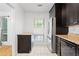 A bright kitchen features stainless steel appliances, granite countertops, and a sunlit window at 1105 Pine Heights Ne Dr, Atlanta, GA 30324