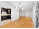 Open layout showcasing the living room with hardwood floors adjacent to the granite kitchen at 1105 Pine Heights Ne Dr, Atlanta, GA 30324