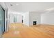 Bright, open living space with hardwood floors, fireplace, and sliding doors for indoor-outdoor flow at 1105 Pine Heights Ne Dr, Atlanta, GA 30324