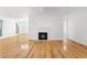 Open-concept living space with hardwood floors, fireplace, and ample lighting for a modern appeal at 1105 Pine Heights Ne Dr, Atlanta, GA 30324