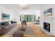 Comfortable living room showcases hardwood floors, a cozy fireplace, and plenty of natural light at 1105 Pine Heights Ne Dr, Atlanta, GA 30324