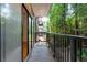 Balcony view overlooking lush greenery and the back of the building at 1105 Pine Heights Ne Dr, Atlanta, GA 30324