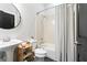 Cozy bathroom featuring a shower-tub combo and vanity with a round mirror at 1195 Milton Se Ter # 5101, Atlanta, GA 30315