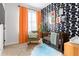 Charming Bedroom with unique wallpaper, soft lighting, and a cozy rocking chair at 1195 Milton Se Ter # 5101, Atlanta, GA 30315