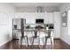 Contemporary kitchen featuring an island with bar seating and stainless steel appliances at 1195 Milton Se Ter # 5101, Atlanta, GA 30315