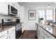 Well-equipped kitchen with stainless steel appliances and granite countertops at 1195 Milton Se Ter # 5101, Atlanta, GA 30315