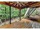Back porch featuring lush wooded views and backyard access at 2530 Ashbourne Dr, Lawrenceville, GA 30043