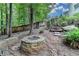 Back yard featuring a brick fire pit, fence, and stairway at 2530 Ashbourne Dr, Lawrenceville, GA 30043