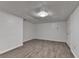 Finished basement with tile floors, recessed lighting, and white walls at 2530 Ashbourne Dr, Lawrenceville, GA 30043