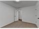 Bedroom with neutral carpeting and two doors. One door leads to another room at 2530 Ashbourne Dr, Lawrenceville, GA 30043