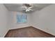 Bright bedroom with hardwood floors, a ceiling fan, and a window at 2530 Ashbourne Dr, Lawrenceville, GA 30043