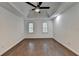 Large bedroom features ceiling fan, hardwood flooring, neutral paint, and recessed lighting at 2530 Ashbourne Dr, Lawrenceville, GA 30043