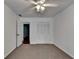 Bedroom with neutral carpet, a ceiling fan, and a closet at 2530 Ashbourne Dr, Lawrenceville, GA 30043