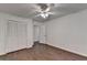 Bedroom featuring a ceiling fan, hardwood floors, and a closet at 2530 Ashbourne Dr, Lawrenceville, GA 30043