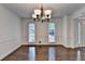 Dining area with hardwood floors, bright lighting, and classic decor at 2530 Ashbourne Dr, Lawrenceville, GA 30043