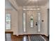 Welcoming entryway with decorative glass door and sidelights and hardwood flooring at 2530 Ashbourne Dr, Lawrenceville, GA 30043