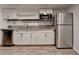 Kitchen with stainless steel fridge, white cabinets, and a tile backsplash at 2530 Ashbourne Dr, Lawrenceville, GA 30043