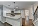 Beautiful kitchen island with granite countertops, sink, and modern pendant lighting at 2530 Ashbourne Dr, Lawrenceville, GA 30043
