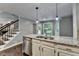 Bright kitchen with granite countertops, stainless steel appliances, and hardwood flooring at 2530 Ashbourne Dr, Lawrenceville, GA 30043