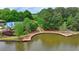 Lake view featuring a bridge spanning the water and lush greenery at 2530 Ashbourne Dr, Lawrenceville, GA 30043