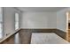 Spacious living room with neutral paint, hardwood floors, and a fireplace at 2530 Ashbourne Dr, Lawrenceville, GA 30043