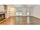 Bright living room with built-in shelves, stone fireplace, and access to the backyard at 2530 Ashbourne Dr, Lawrenceville, GA 30043