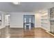 Open-concept living room with hardwood floors and view to the entry at 2530 Ashbourne Dr, Lawrenceville, GA 30043