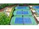An aerial view of a community with shuffleboard, beach volleyball, picnic tables, and other outdoor games at 2530 Ashbourne Dr, Lawrenceville, GA 30043