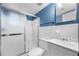 Modern bathroom features a shower with glass doors, vanity, and great lighting at 3664 Pin Oak Cir, Atlanta, GA 30340