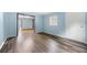 Spacious room with plank floors, a full view of a window and a traditional door at 3664 Pin Oak Cir, Atlanta, GA 30340