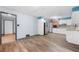 Bright kitchen with stainless steel refrigerator, white cabinets, and wood-look flooring at 3664 Pin Oak Cir, Atlanta, GA 30340