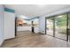 Open kitchen featuring white cabinets, stainless appliances, and sliding glass door to backyard at 3664 Pin Oak Cir, Atlanta, GA 30340