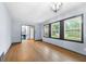 Inviting living room featuring beautiful hardwood floors and ample natural light from the windows at 3664 Pin Oak Cir, Atlanta, GA 30340