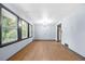 Open-concept living room with hardwood floors and ample natural light at 3664 Pin Oak Cir, Atlanta, GA 30340